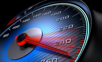 Close-up of a speedometer showing high speed.